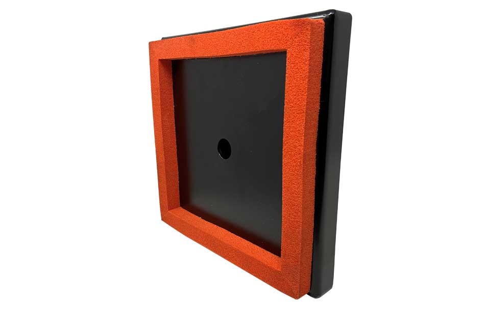 Black square object with a red border on a white background