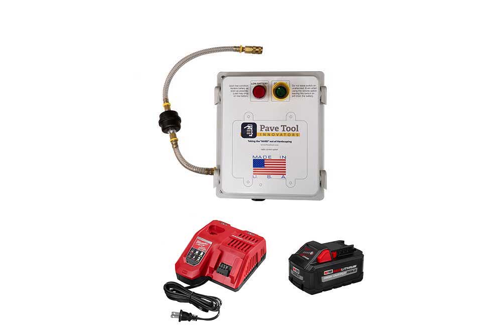 A yellow power pack device with a white control panel labeled 'Pave Tool' attached to a piece of construction equipment.